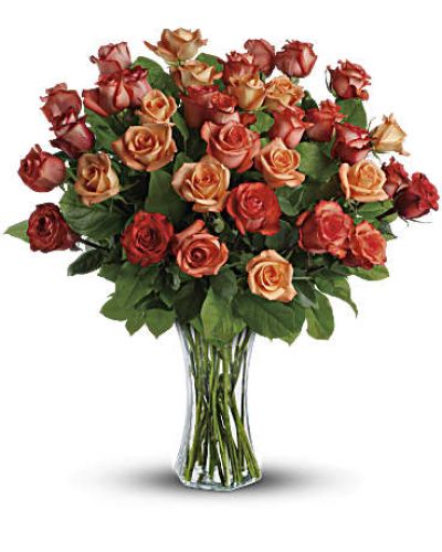 <div id="mark-2" class="m-pdp-tabs-marketing-description">The sun will come out tomorrow, and tomorrow, and tomorrow with this blazing bouquet of orange roses. Orange, light orange and dark orange - gorgeous roses delivered in a sparkling flared glass vase. No doubt about it, this is one hot gift.</div>
<p> </p>
<div id="desc-2">
<ul>
<li>This spectacular bouquet includes orange roses, light orange roses and dark oranges accented with salal.</li>
<li>Delivered in a flared glass vase.</li>
</ul>
</div>